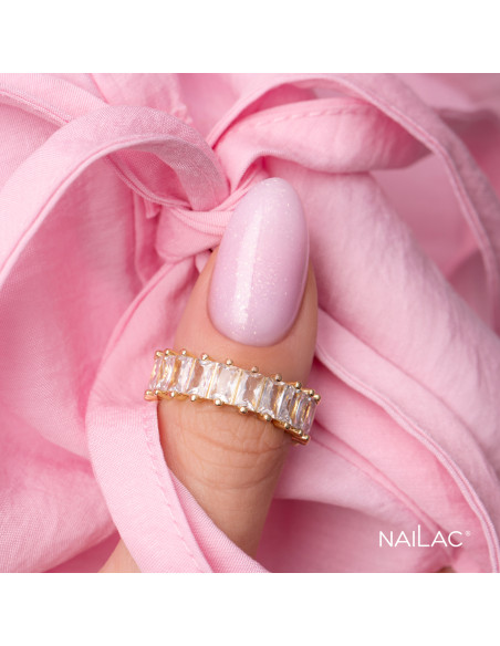 Kciuk pokryty różowym żelem w butelce