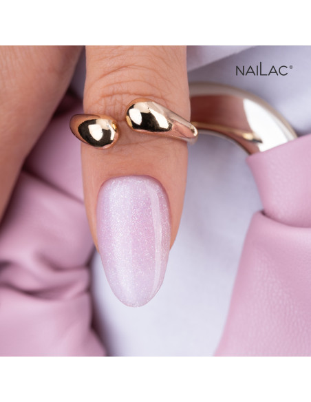 Kciuk pokryty jasnym różowym żelem w butelce z drobinkami Jelly Bottle Bling Beauty