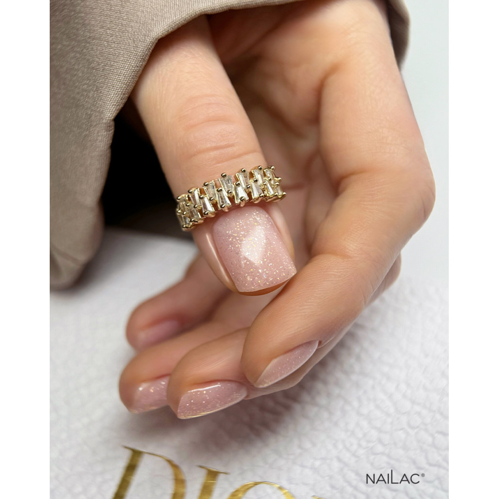 Manicure hybrydowy. Paznokcie pokryte bazą kauczukową z brokatem Crystal Base w kolorze Unicorn. Wyk. @dariakrol.nails