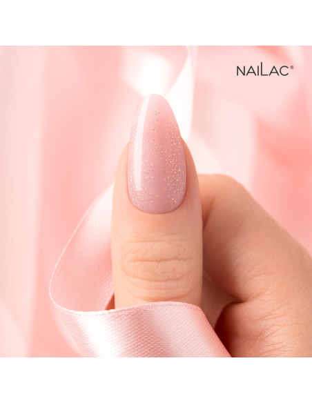 Manicure żelowy. Paznokcieć ozdobiony żelem w butelce Jelly Bottle Bling Lolita w kolorze budynioworóżowym ze złotymi drobinkami