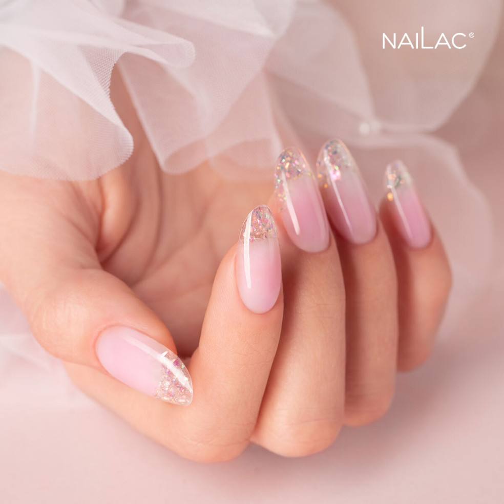 Manicure żelowy. Paznokcie ozdobione przezroczystym żelem w butelce z drobinkami holo - Jelly Bottle Confetti