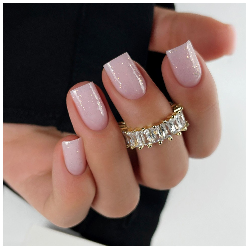 Manicure hybrydowy wykończony mlecznoróżowym topem z drobinkami OpalX Top Blush Gold Manicure hybrydowy wykończony mlecznoróżowym topem z drobinkami OpalX Top Blush Gold