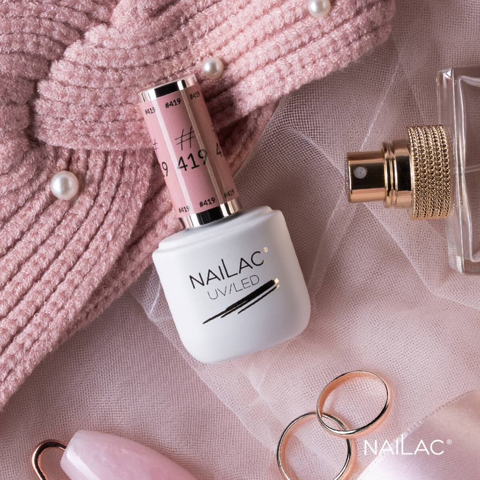 Butelka z lakierem hybrydowym w kolorze pudrowego różu Butelka z lakierem hybrydowym w kolorze pudrowego różu