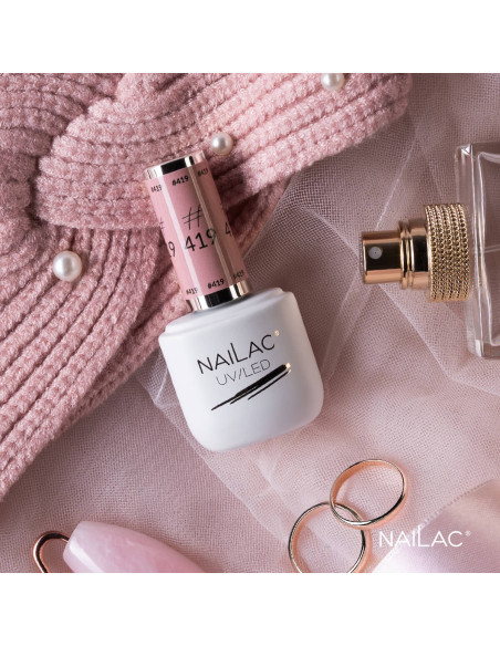 Butelka z lakierem hybrydowym w kolorze pudrowego różu Butelka z lakierem hybrydowym w kolorze pudrowego różu