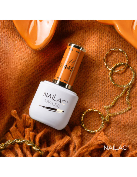 Butelka z lakierem hybrydowym w kolorze pomarańczowym Butelka z lakierem hybrydowym w kolorze pomarańczowym